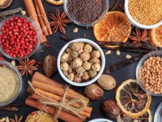 120186242-spices-and-herbs-colorful-spices-flat-lay-on-wooden-table-banner